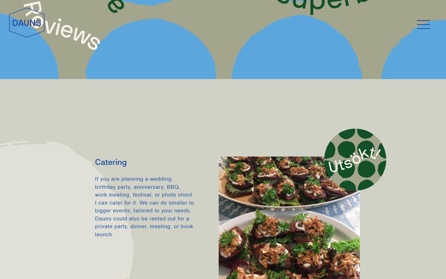 DAUNS catering section with a photo of a spread of vegan dishes