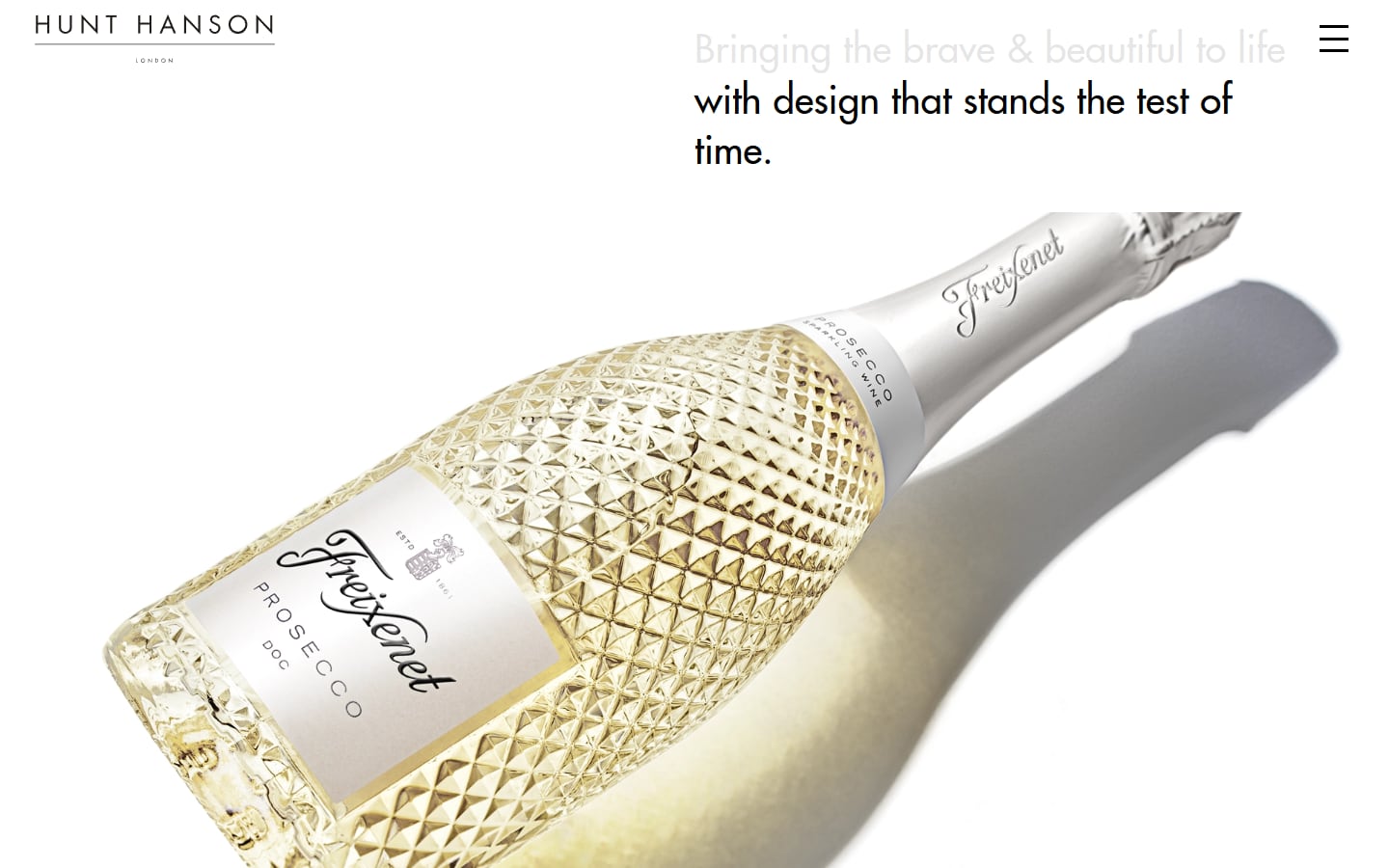 Hunt Hanson homepage: the agency tagline above a Freixenet prosecco bottle